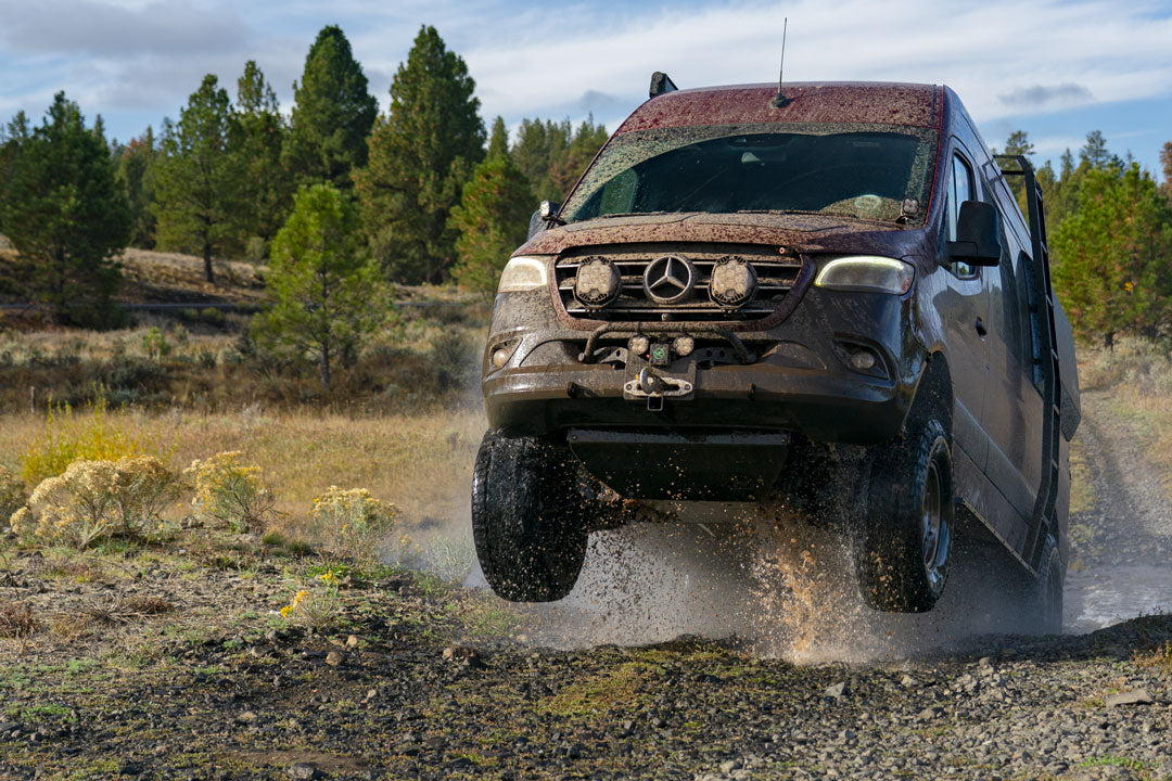 4x4 Sprinter van flying through the air.