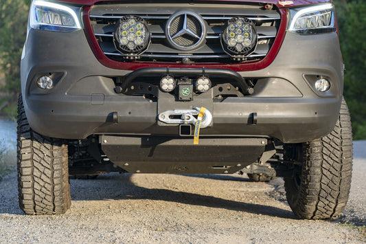 Front view of a Sprinter van showcasing the VAN COMPASS FRONT WINCH MOUNT WITH BULL BAR, highlighting its reinforced structure and integrated tow points.