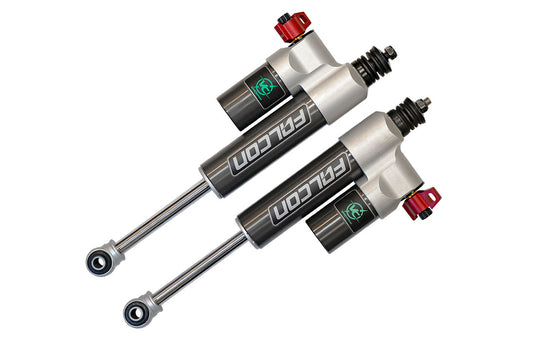 Pair of Falcon 3.3 Fast Adjust Front Shocks for Sprinter 4x4, featuring black and silver cylinders with red adjustment knobs.
