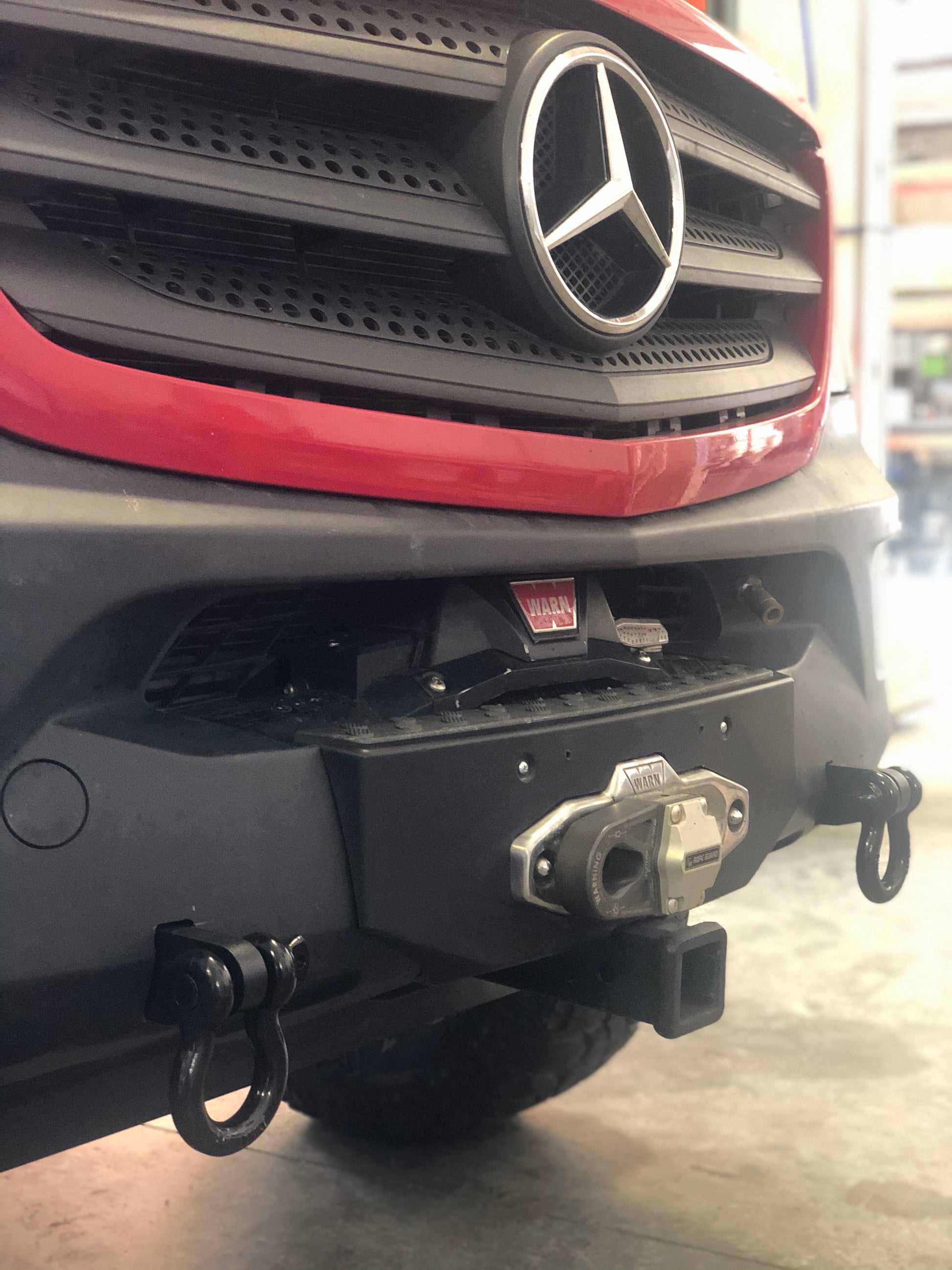 Close-up of the VAN COMPASS FRONT WINCH BUMPER for Sprinter (2015-2018), showcasing the robust steel construction and integrated winch mounting system.