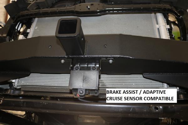 Close-up of the Van Compass front receiver hitch for Ford Transit, showing the high-strength steel construction and compatibility with front-end sensors.