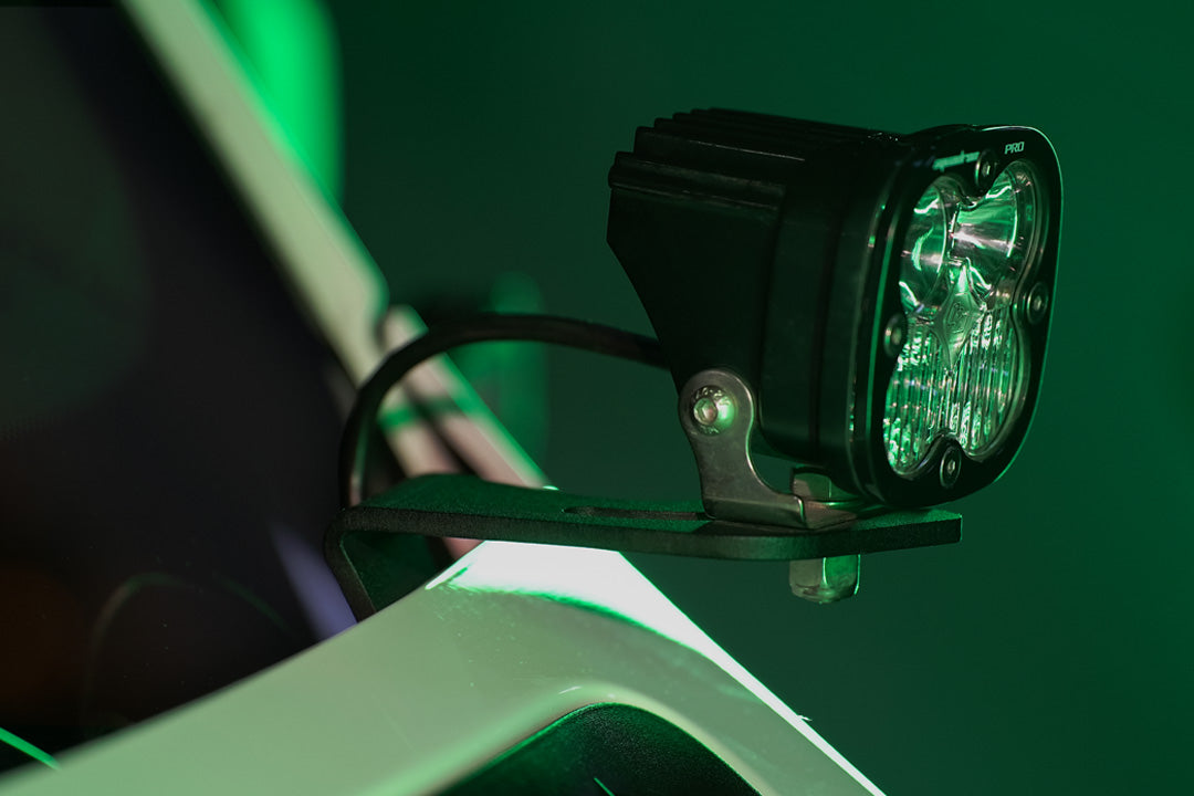 HOODLINE LIGHT POD MOUNT - SPRINTER (2019+) by VAN COMPASS: Close-up of a van's hood, showcasing easily installed LED pod mounts attached to the factory hood hinge studs.