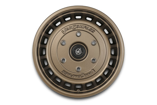 A bronze-colored multi-spoke wheel rim with 'Van Compass' branding on the center cap, shown against a plain white background.