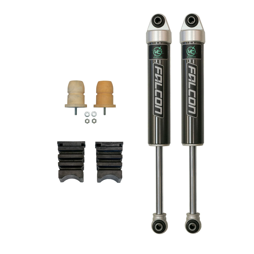 Pair of black shock absorbers with visible logos, part of the STAGE 3 SYSTEM - SPRINTER 2WD (2007+ 2500) by VAN COMPASS, enhancing stability and control.