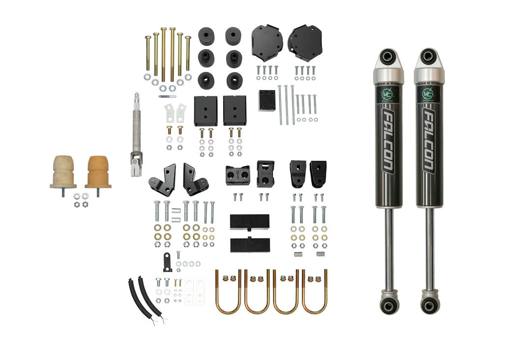 Stage 4 System, 2 Lift - Sprinter 2WD (2019+ 3500) by Van Compass, showing black shock absorbers and various vehicle parts for increased ground clearance and stability.